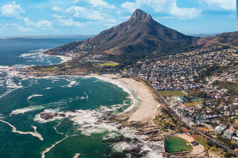 Aerial photograph of Camps Bay Beach and business strip